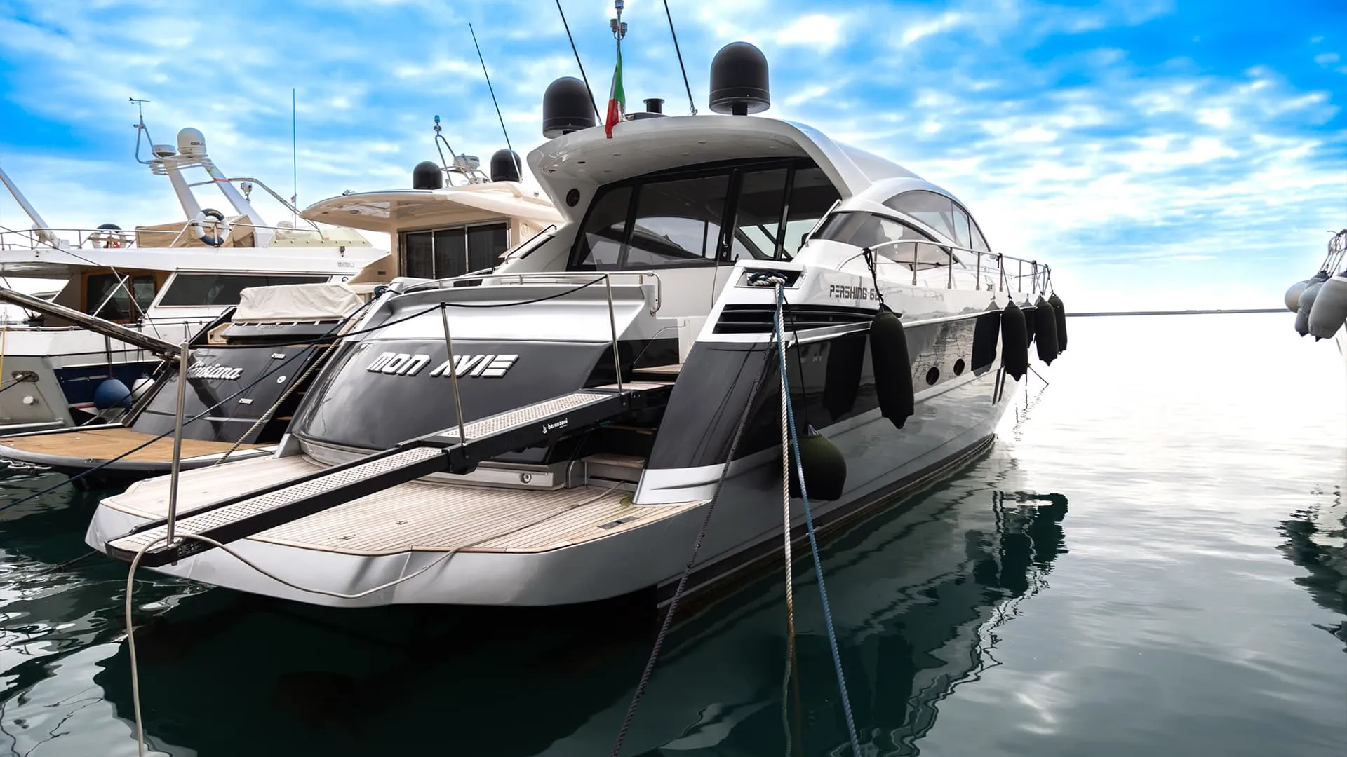 A premium motor yacht at speed off the Costa Smeralda